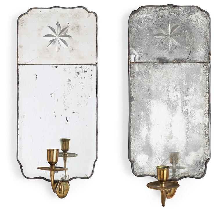 A pair of Swedish 18th century one-light girandole mirrors.