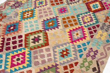 A Kelim rug, c. 252 x 180 cm.