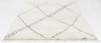 A Moroccan carpet, c. 282 x 150 cm.