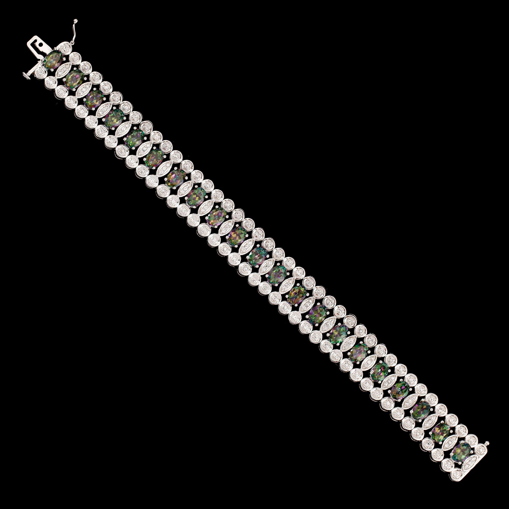 ARMBAND, sterlingsilver, vita och färgade topaser tot ca 25.00 ct.