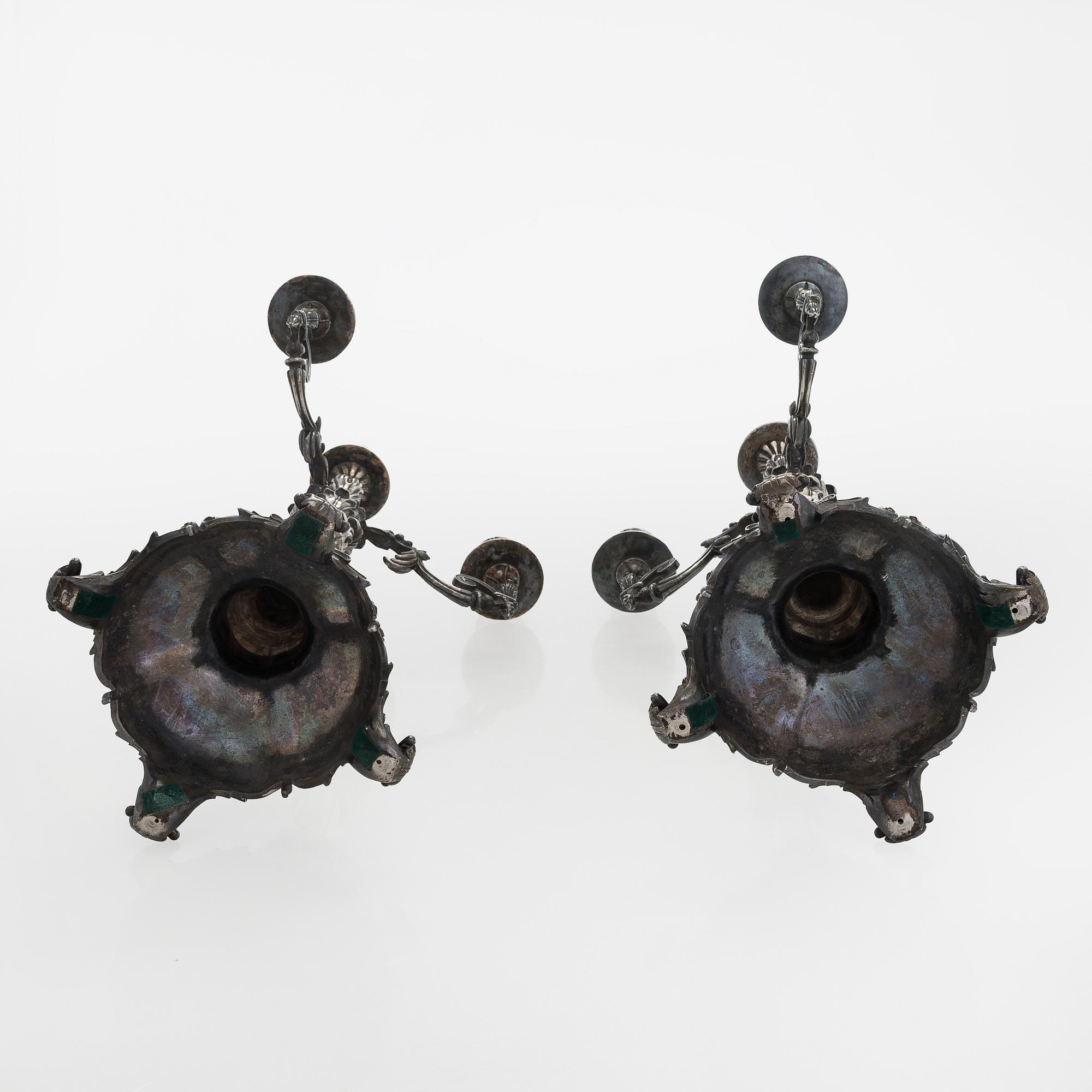 A pair of silver candelabra, maker marks of Carl Johan Tegelsten, Saint Petersburg 1850.