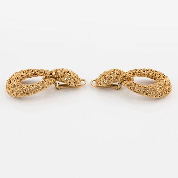 A pair of 18K gold earrings.