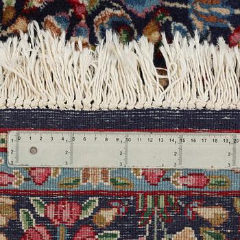 A Kirman rug, old, ca 272 x 193 cm.