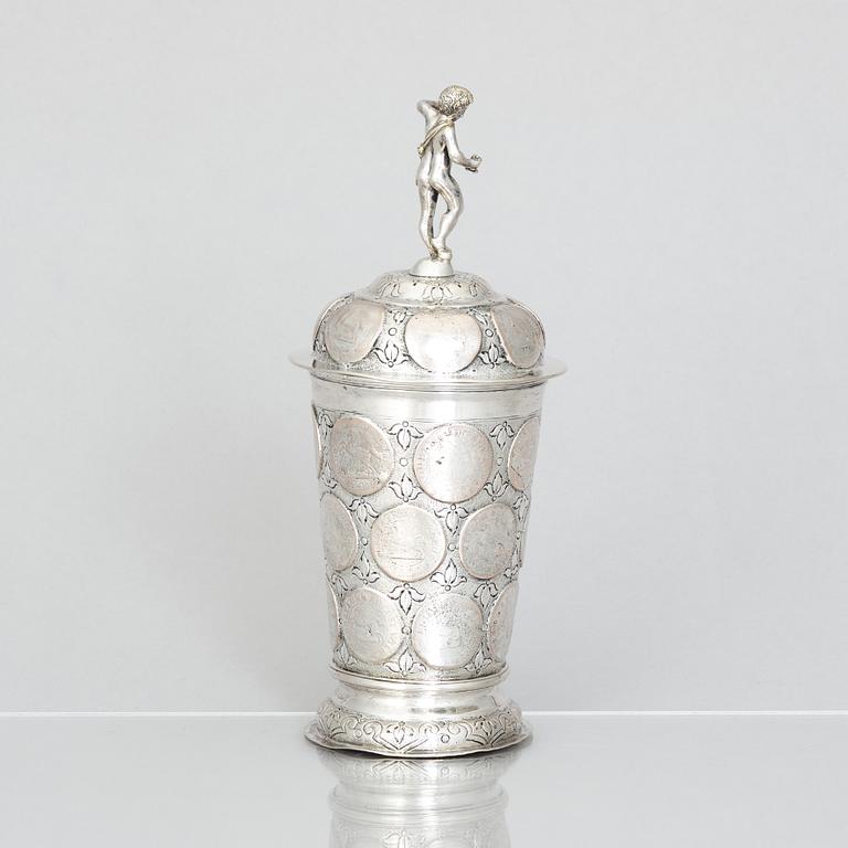 An 19th century parcel-gilt silver cup with lid, unidentified makers mark, probably Nürnberg.