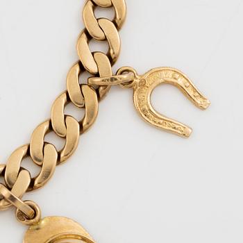 Bracelet 18K gold with charms.