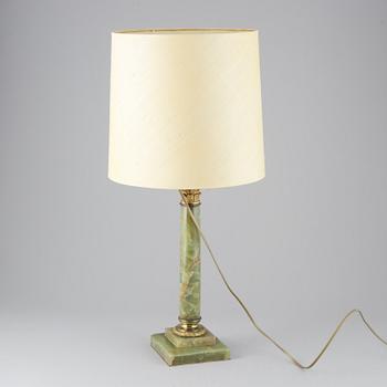 A 20th century empire style table lamp.