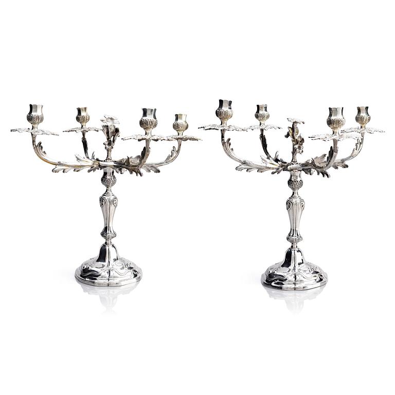 A pair of German 18th century silver candelabras, mark of C.C. Papcke, Stralsund.