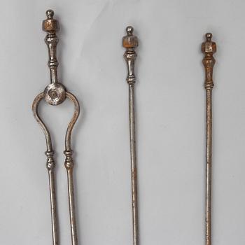 A set of three steel fire irons, 19th century.