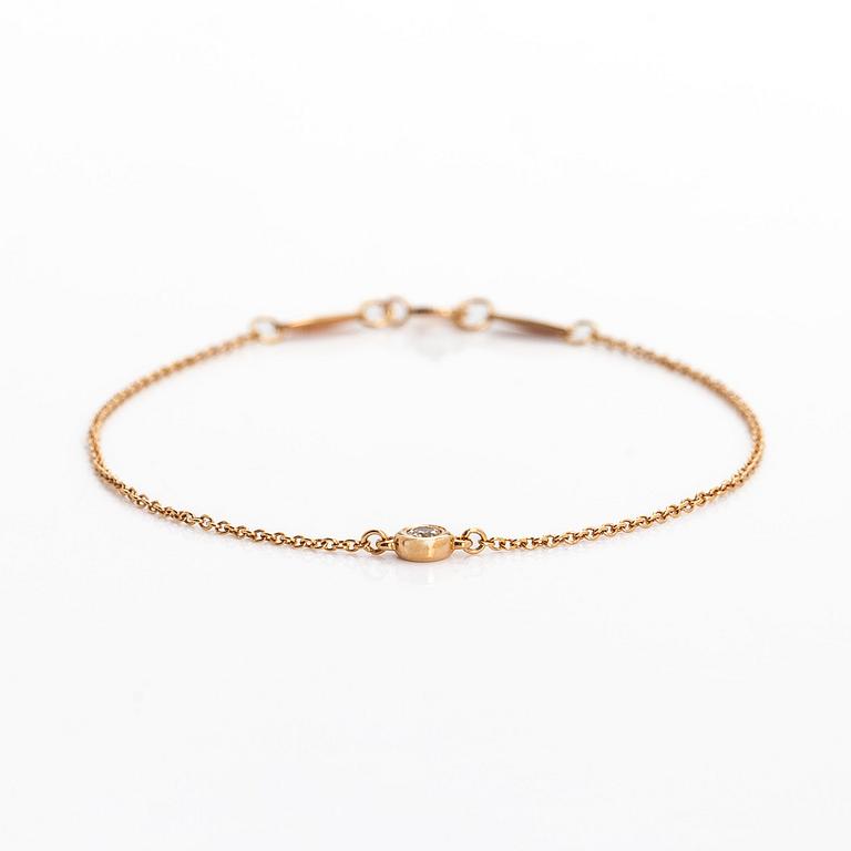 Tiffany & Co, Elsa Peretti, an 18K gold bracelet, 'Diamonds by the Yard', with a diamond approximately 0.08 ct.