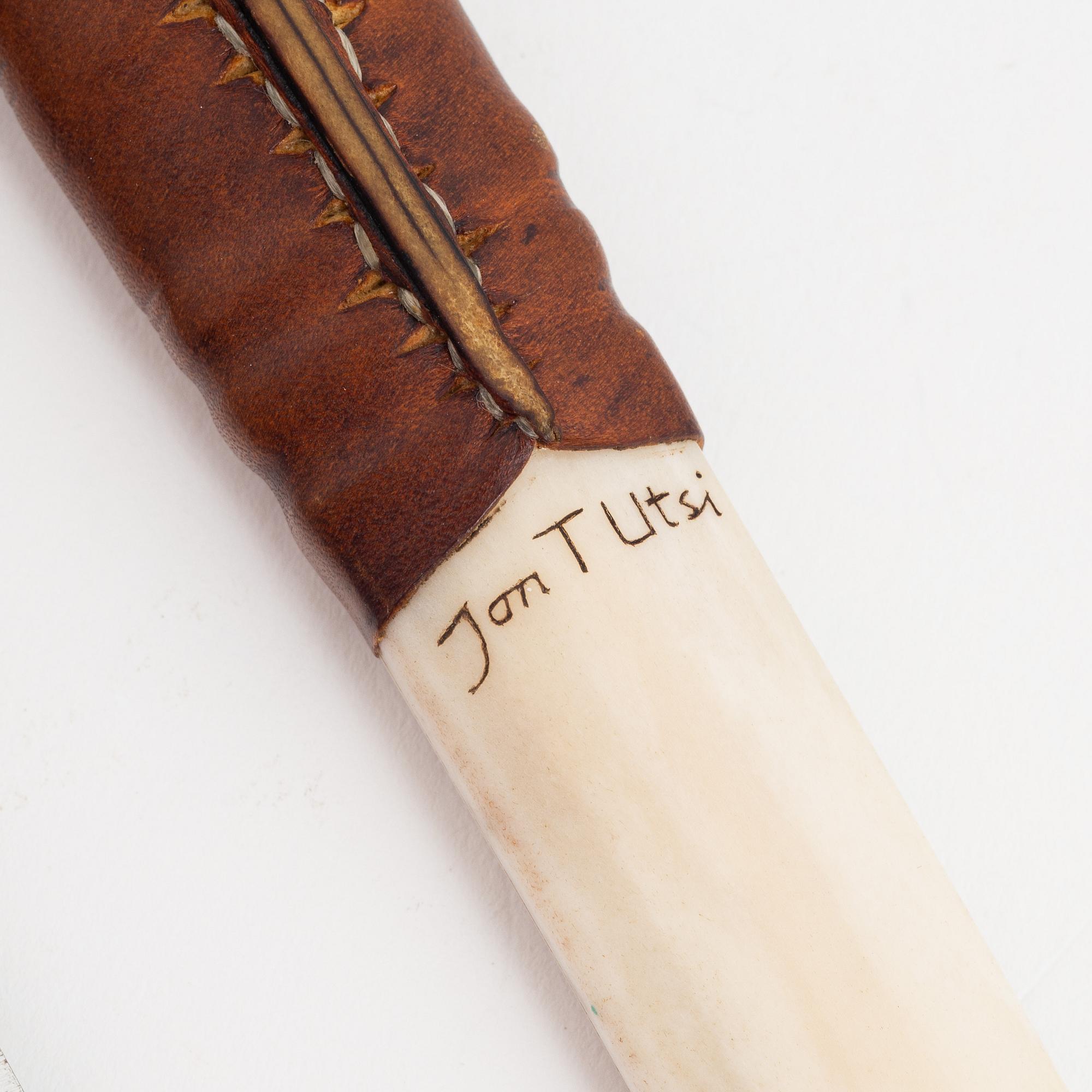 Jon Tomas Utsi, a reindeer horn knife, signed Jon T Utsi.
