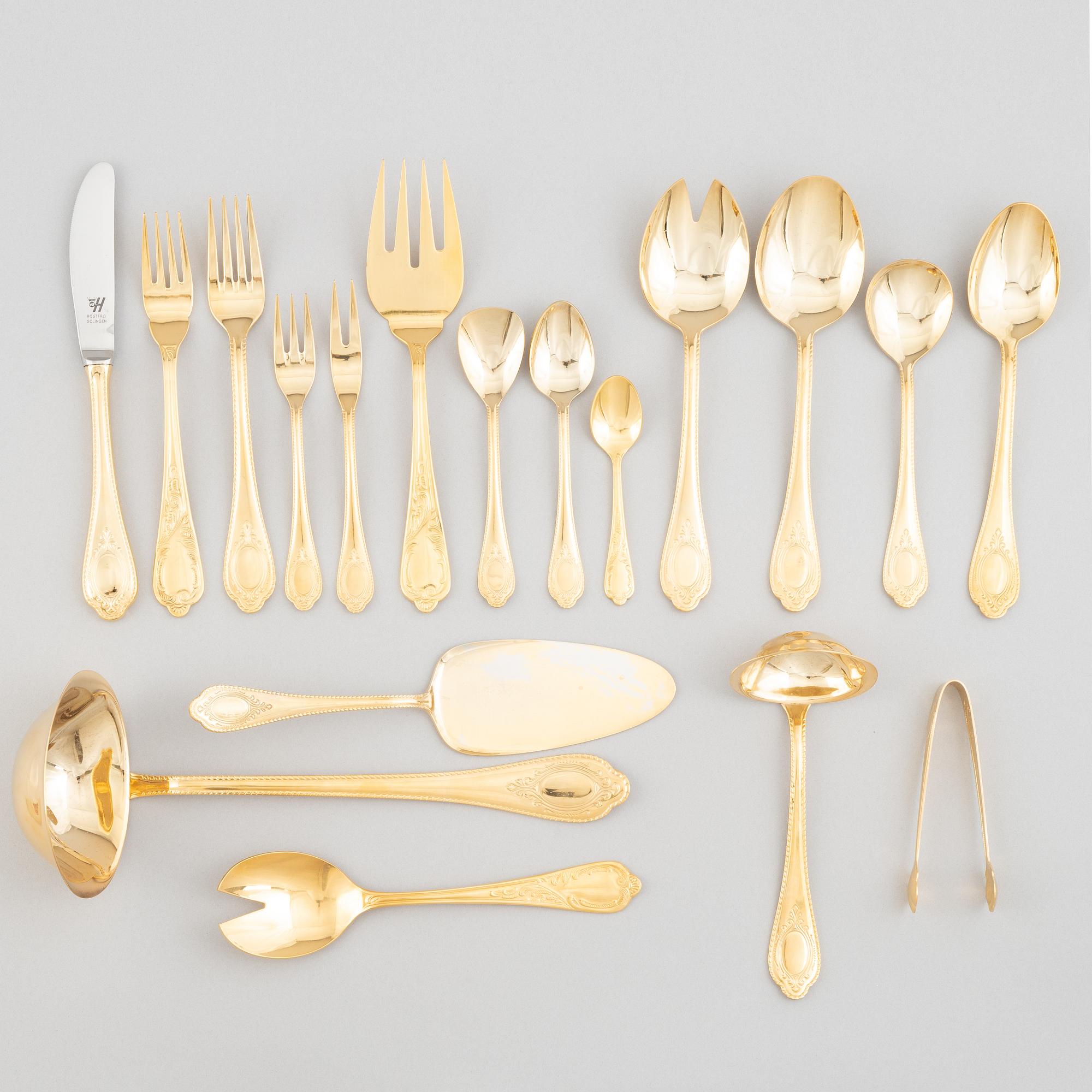 A 107-piece 23/24K gilded stainless steel flat wear set, mostly te same model, Solingen, Germany.