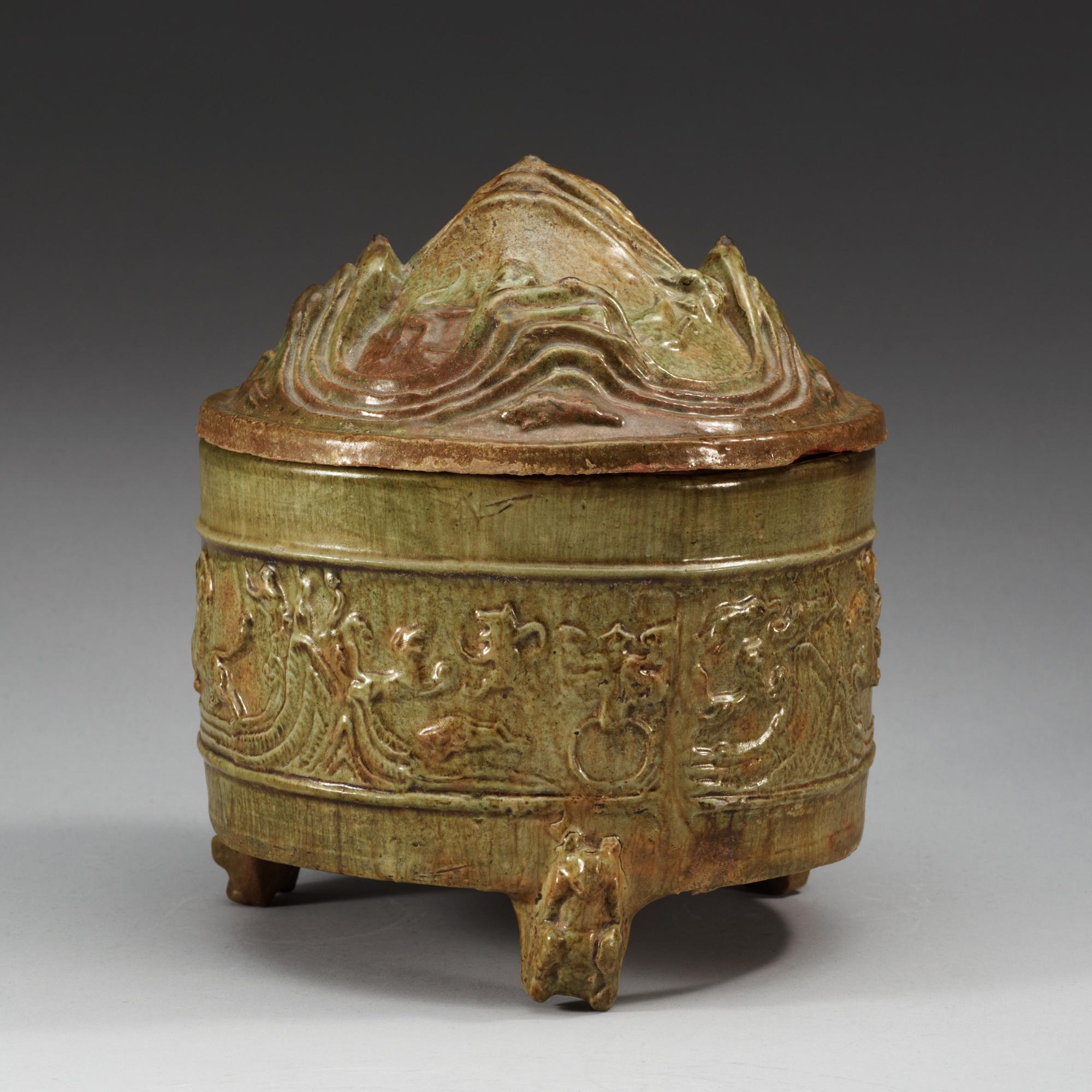 A green glazed tripod censer with cover, Han dynasty (206 BC - 220 AD).