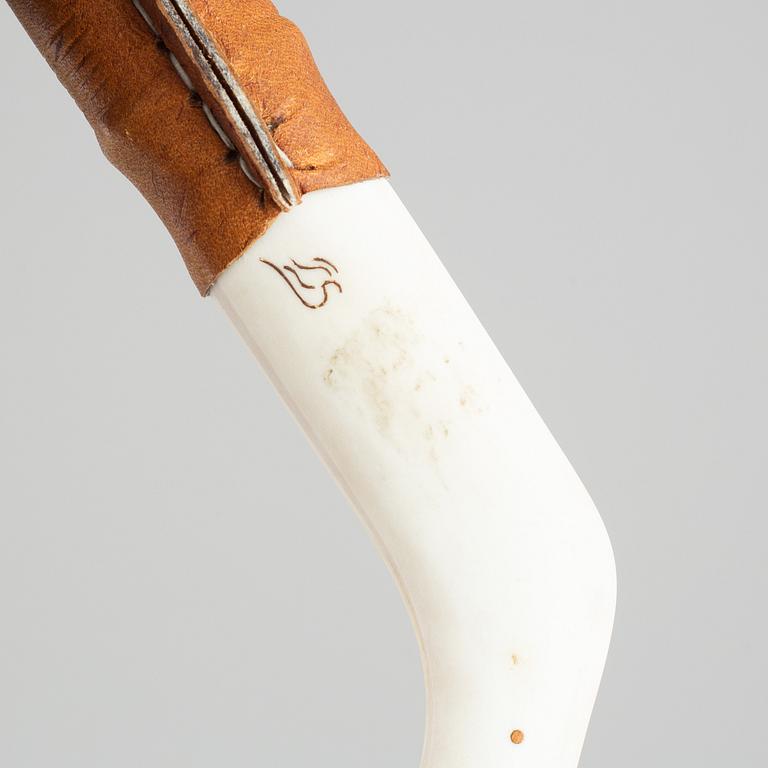 Per Erik Svonni, a Sami reindeer horn knife, signed P.E. Sv.