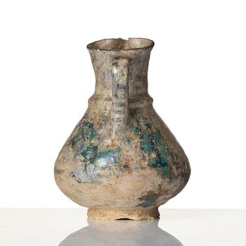 A turquoise-glazed Keshan jug, Persian, 13th century.