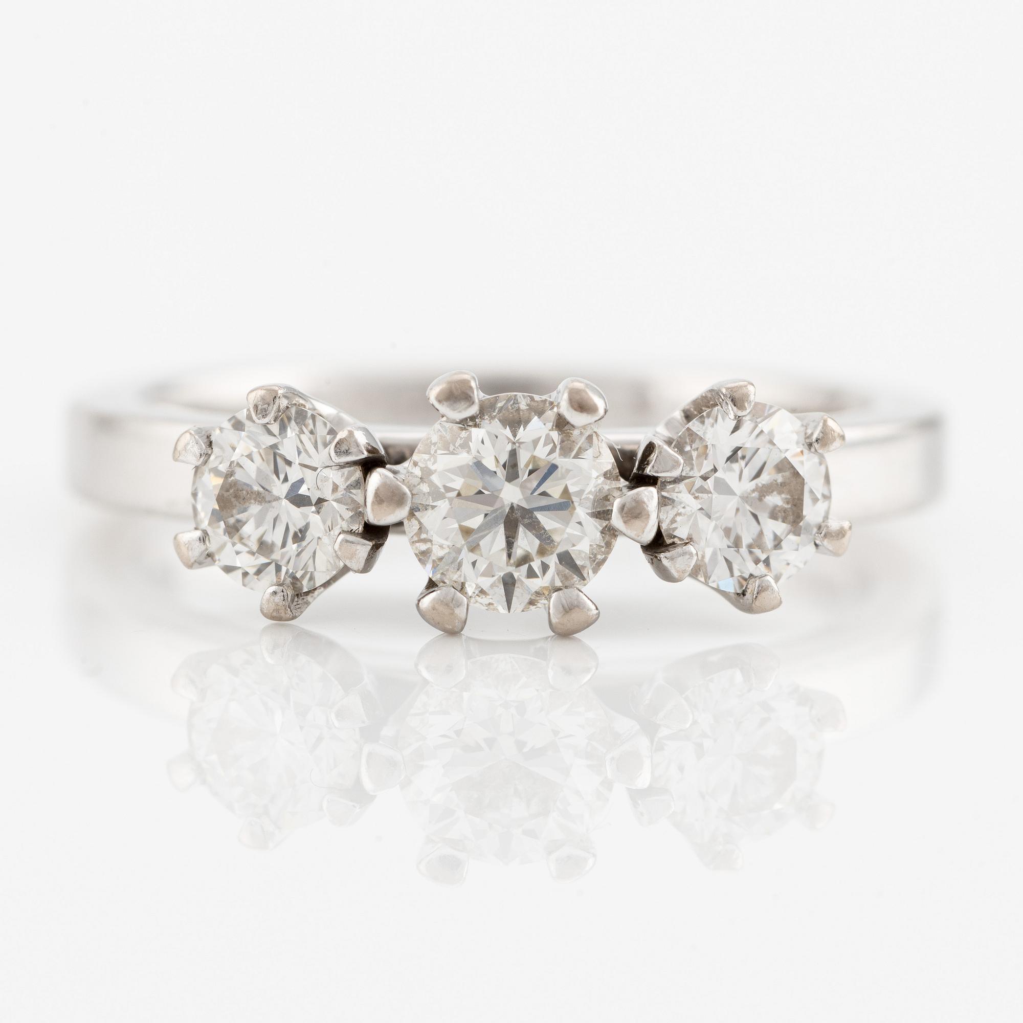 Ring, Schalins, 18K white gold with three brilliant-cut diamonds, accompanying GIA dossier.