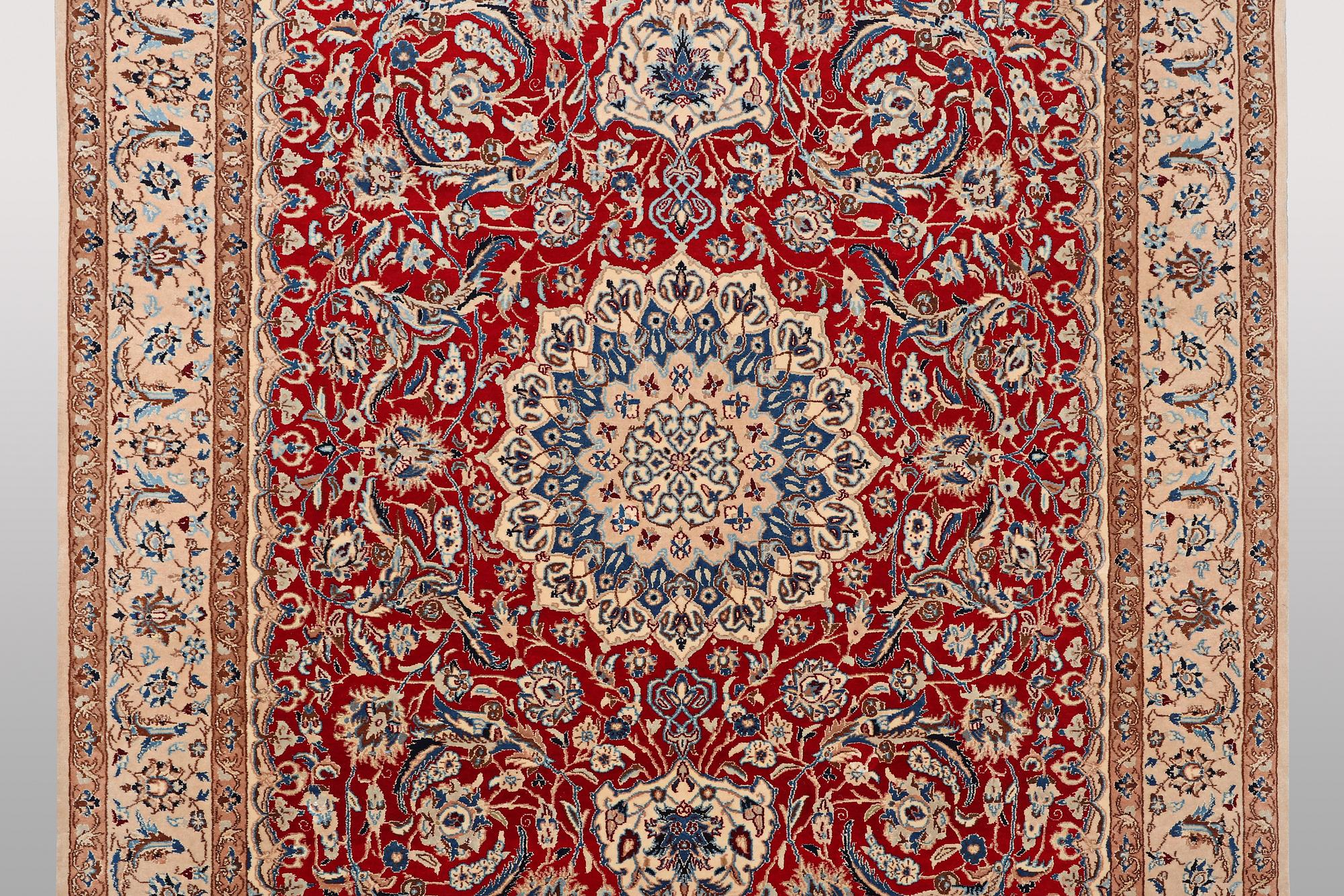 A carpet, Nain, part silk, 9 Laa, ca 295 x 178 cm.