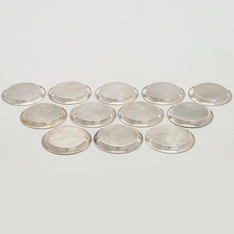 A 12-piece set of silver glass coasters, Kultakeskus, Hämeenlinna 1952. In original fitted case.