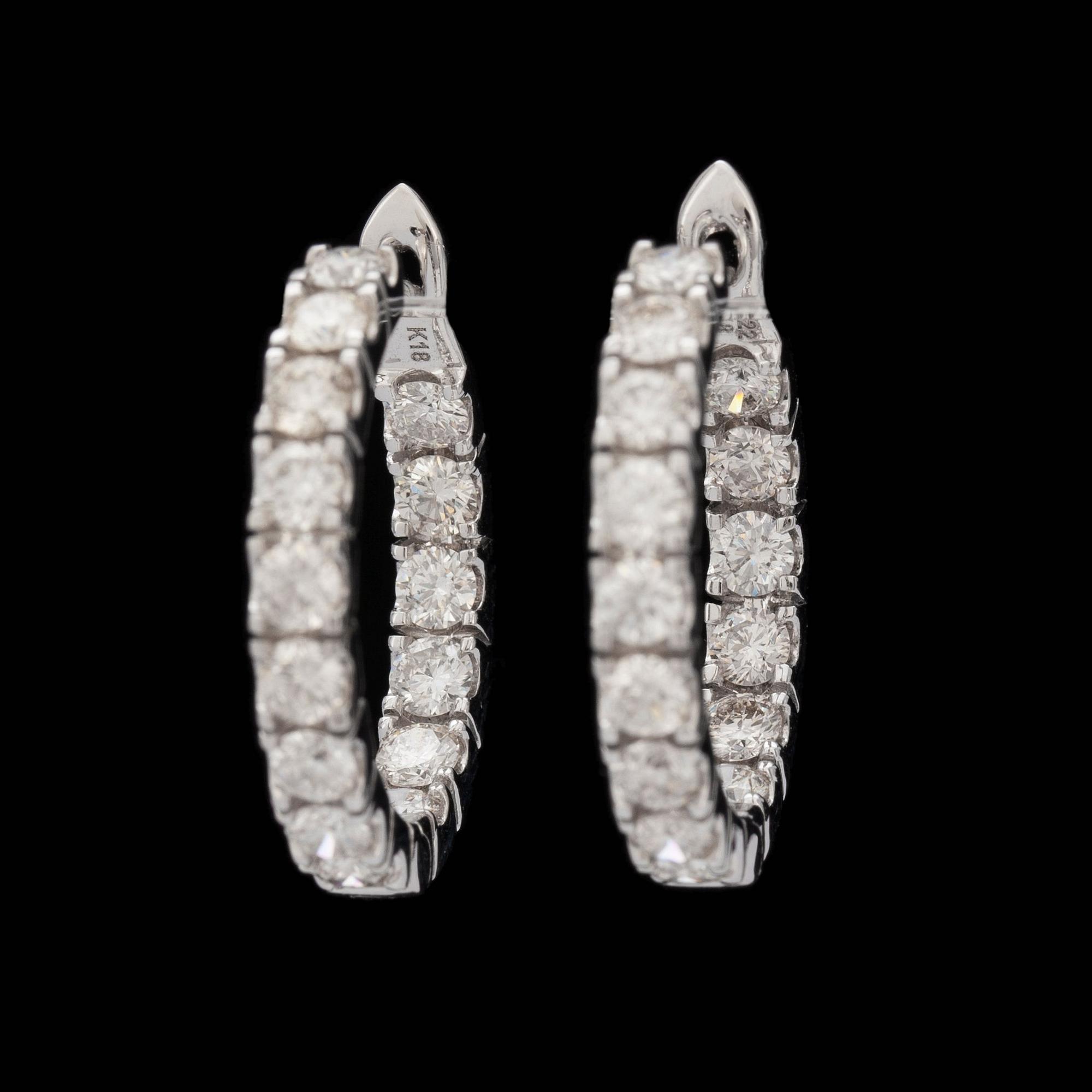 A pair of brilliant-cut diamond hoop earrings, total carat weight 2.22 cts.