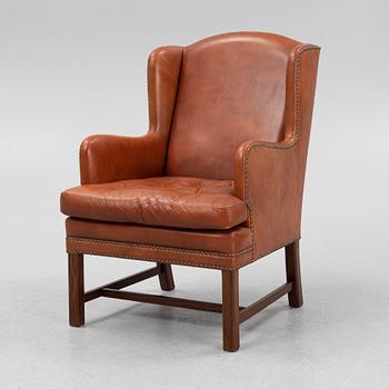 A leather upholstered easy chair, second part of the 20th Century.
