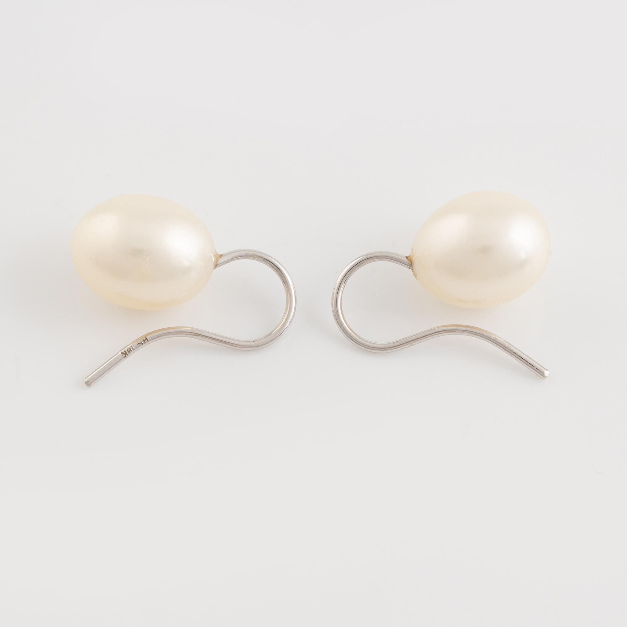 A pair of white gold earrings with cultured pearls.