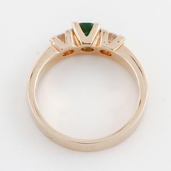 A green tourmaline rand brilliant cut diamond ring.