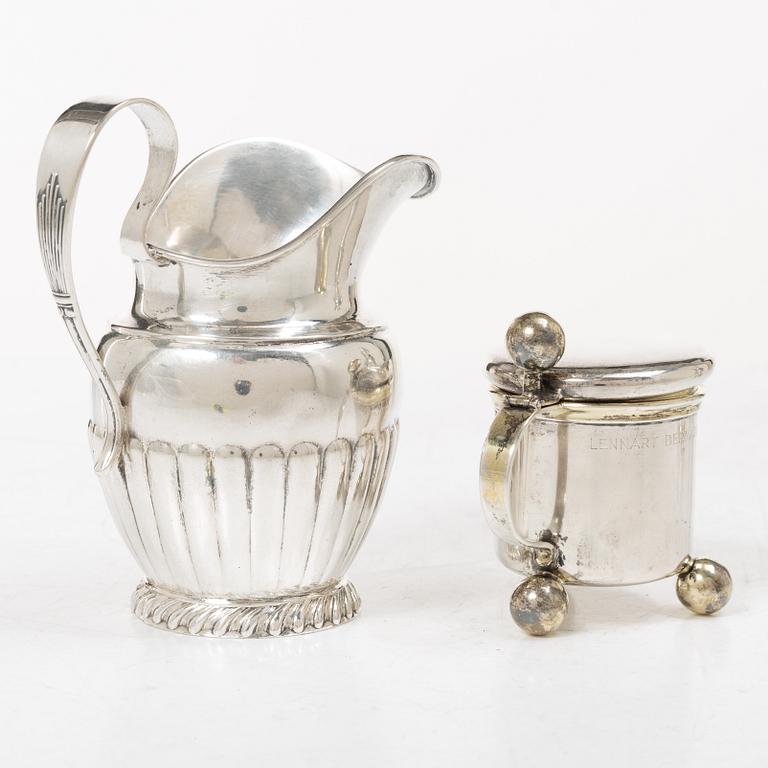 Sugar tongs, cream jug and miniature decanter, silver, including CG Hallberg, Stockholm 1955.