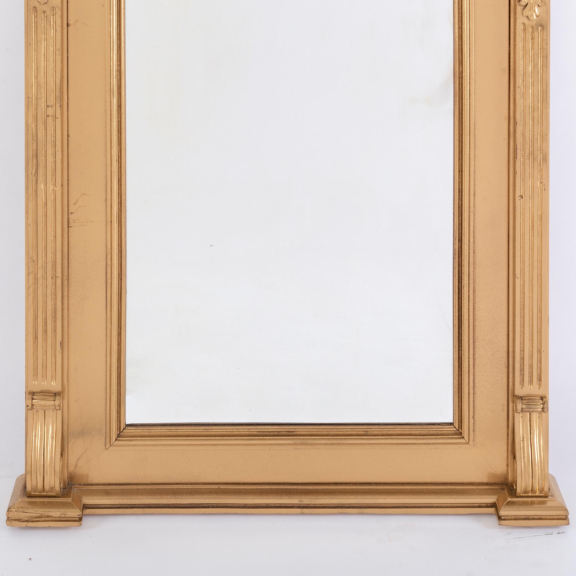 An end of the 19th Century rennaisance style bronzed mirror-.