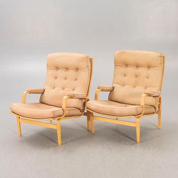 A pair of Bruno Mathsson Ingrid leather armchairs later part of the 20th century.