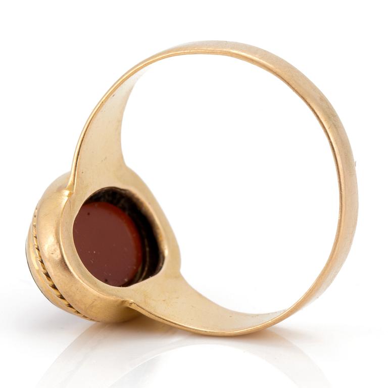 A signet ring set with carnelian.