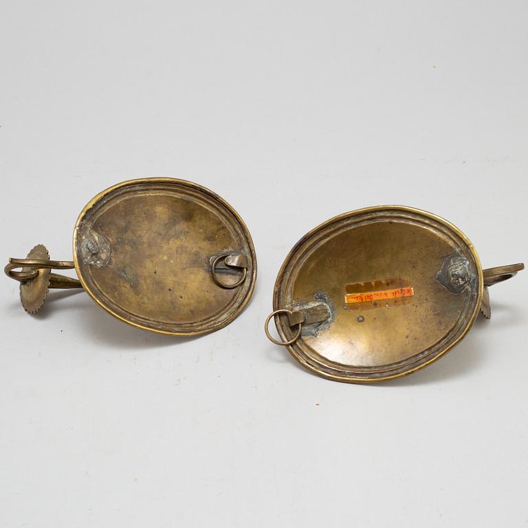 A pair of 18th century brass wall scones.