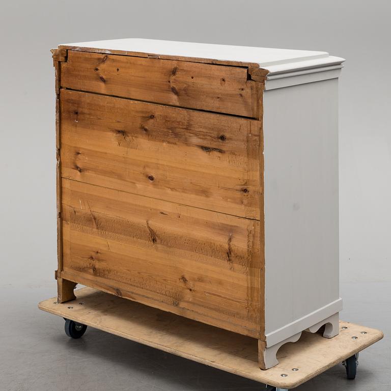 an early 20th century painted chest of drawers.