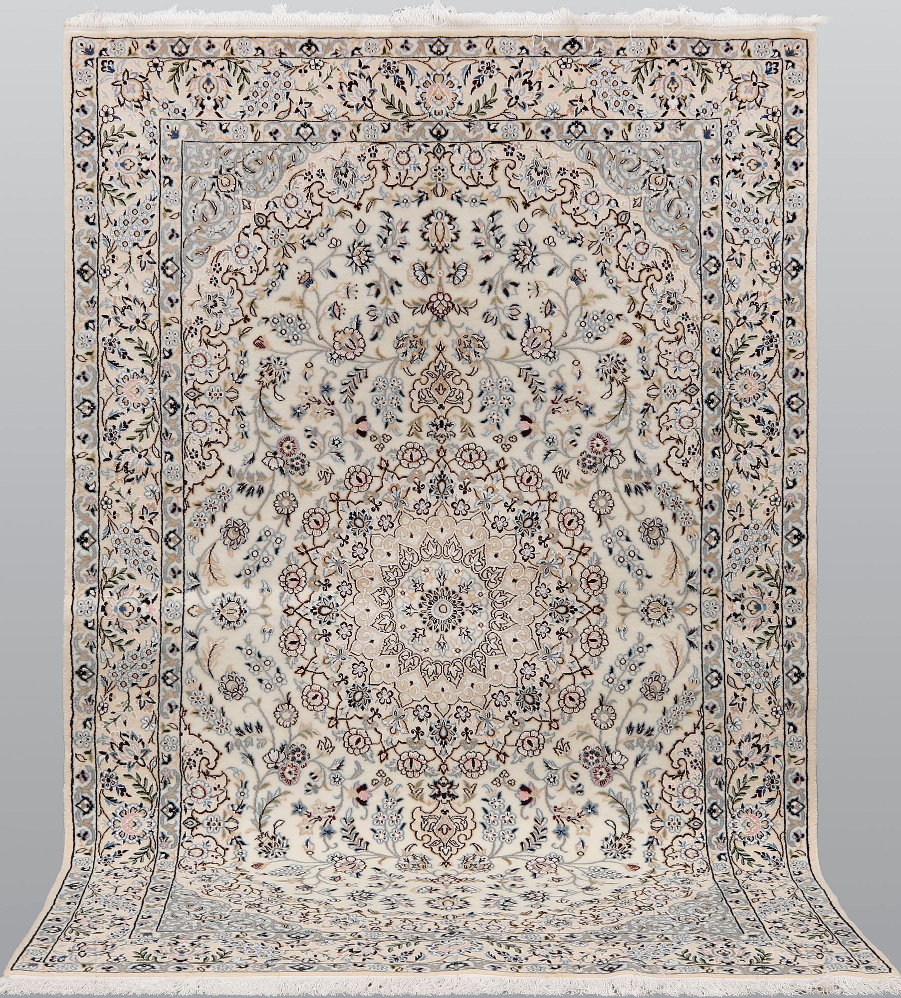A Nain part silk carpet, 254 x 156 cm.