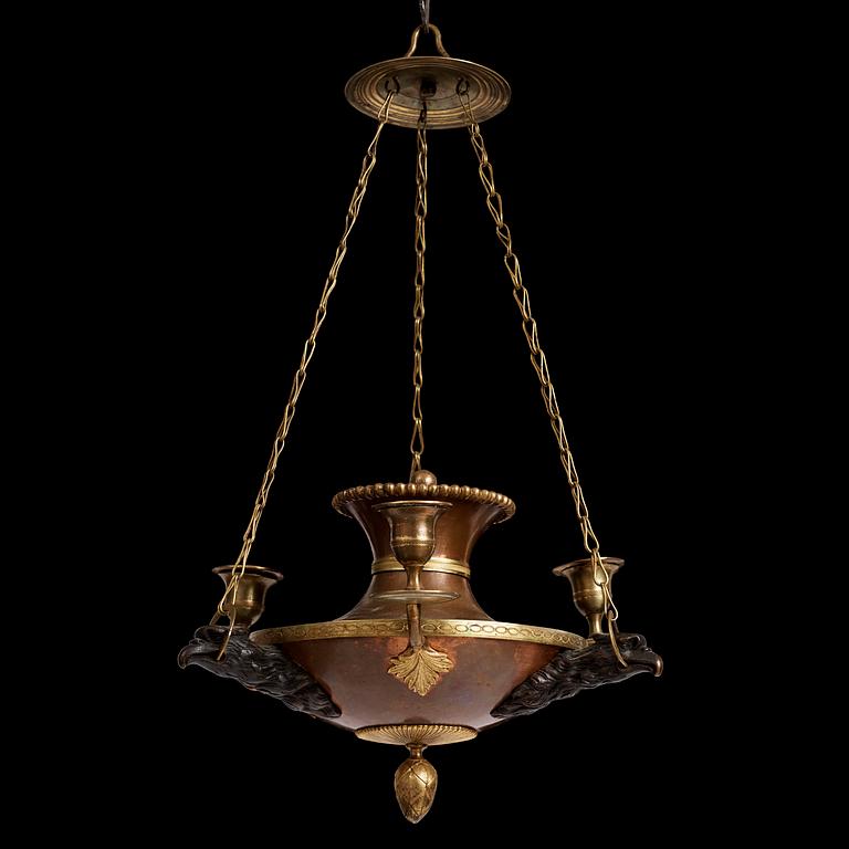 A Swedish patinated bronze and copper three-light chandelier, early 19th century.