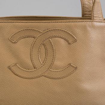 a CHANEL caviar leather bag.