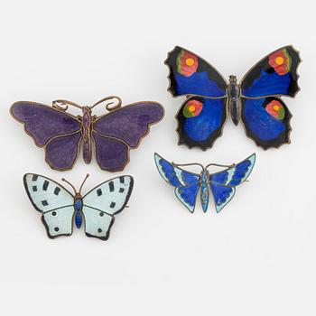 Four silver and enamel butterfly brooches.