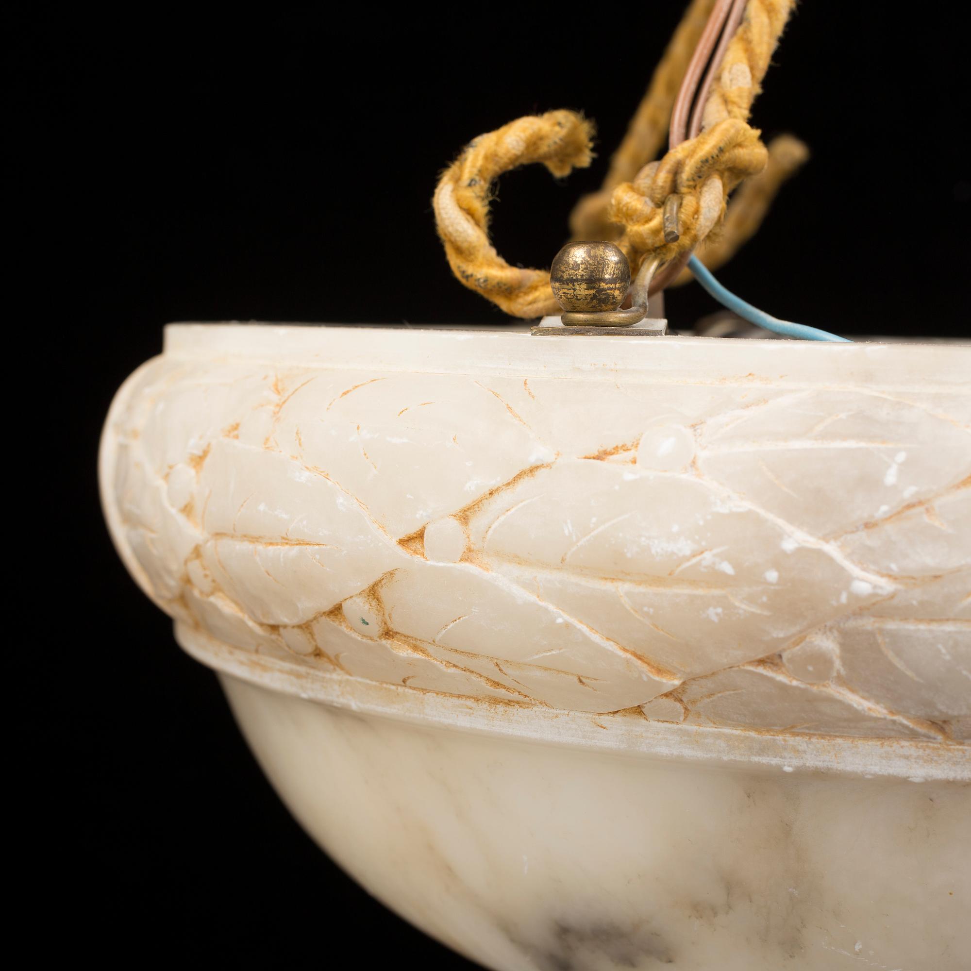 An early 20th century alabaster ceiling lamp.