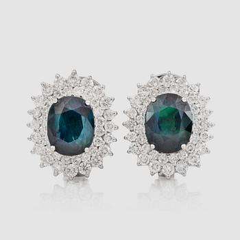 1380. A pair of greenish-blue untreated sapphire and brilliant-cut diamond earrings.