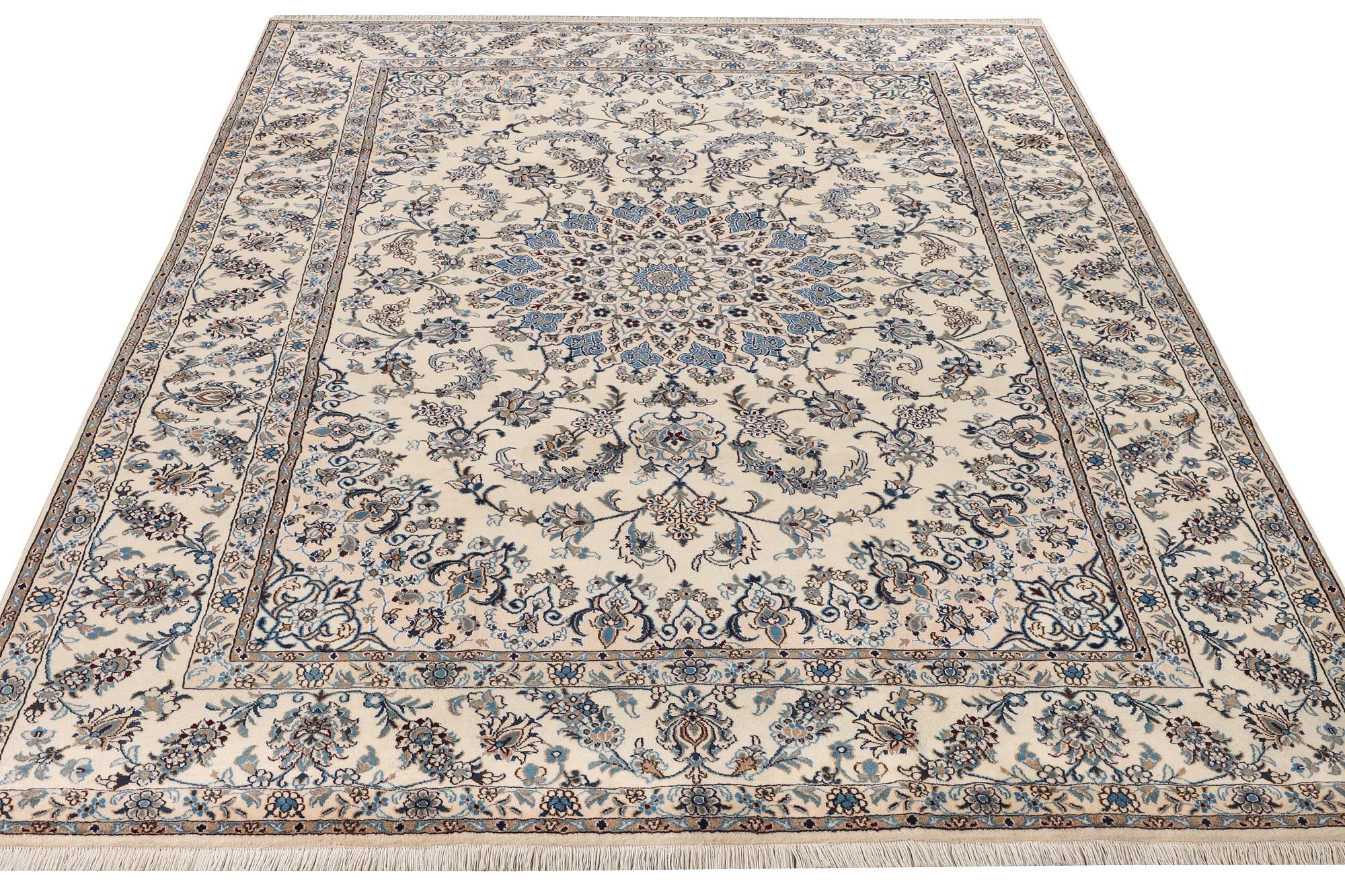 A Nain, part silk carpet, c. 337 x 244 cm.