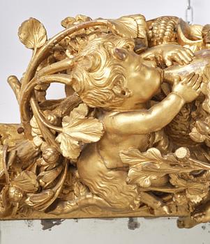 A presumably Dutch Louis XIV carved giltwood frame with mirror glass, in the style of Jean Le Pautre, late 17th century.