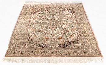 A silk Ghom rug, c. 185 x 122 cm.