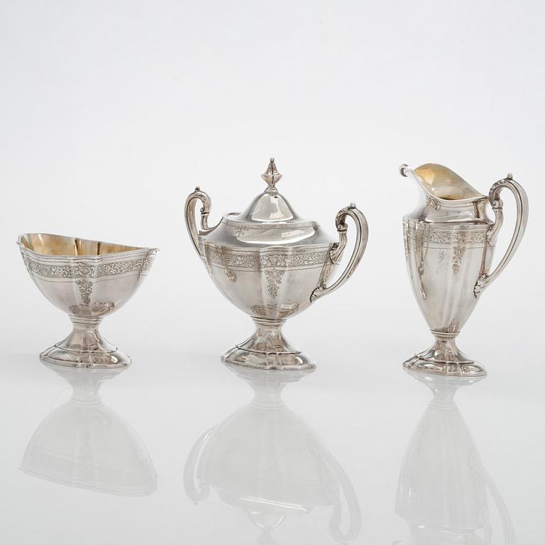 A five-piece sterling silver coffee and tea service, and 12 spoons, USA, first quarter of the 20th century.