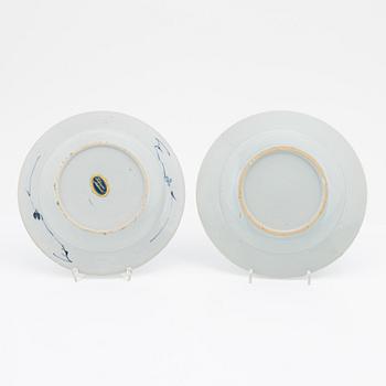 A blue and white serving dish and eight odd plates, Qing dynasty, 18th Century.