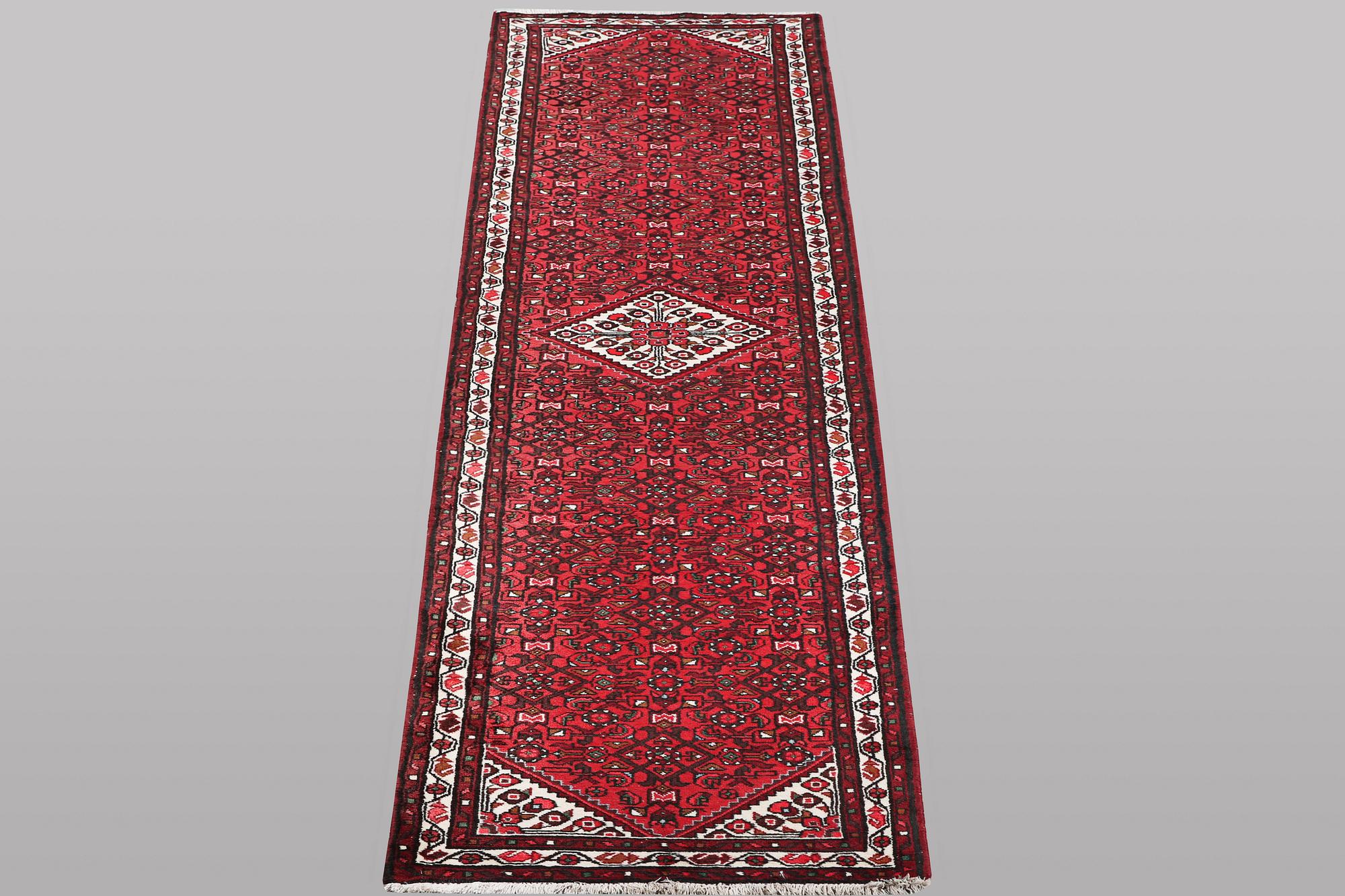 A runner carpet, Hosseinabad, ca 393 x 82 cm.
