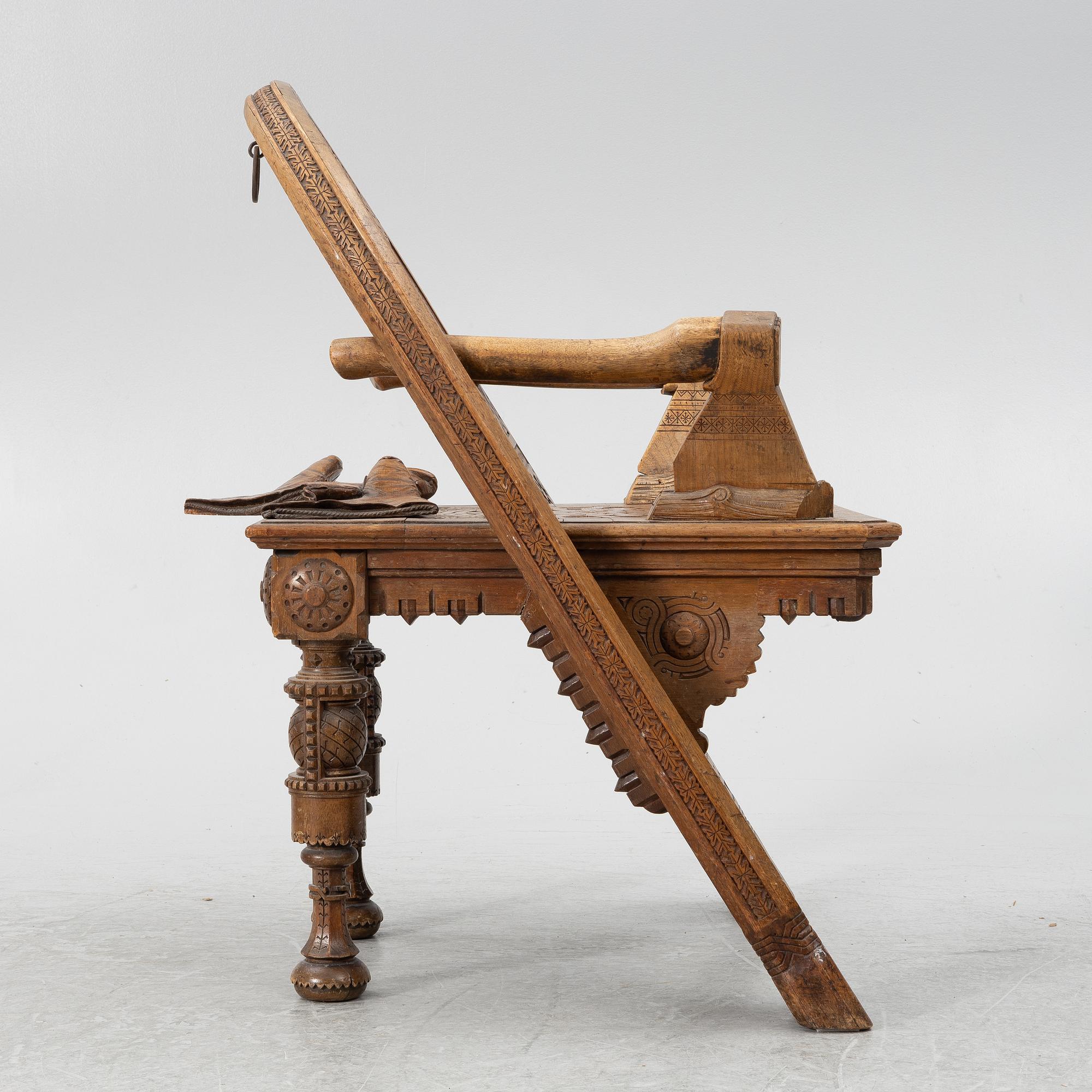 Armchair, after a design by Vasily Shutov called 'Arc, Axes and Mittens' Russia late 19th century.