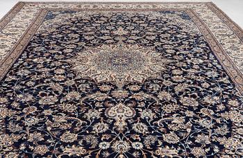 A Nain part silk carpet, c. 535 x 340 cm.