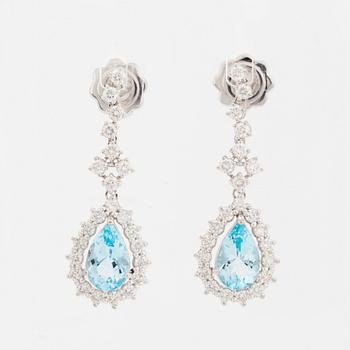 Topaz and brilliant-cut diamond earrings.