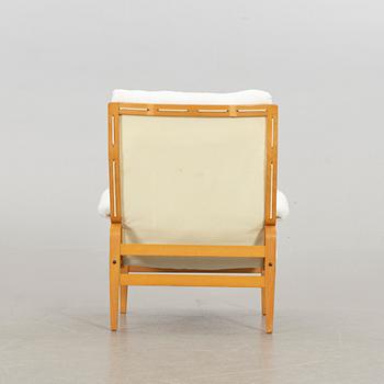 BRUNO MATHSSON, an "ingrid" armchair and stool for Dux. Late 20th century.