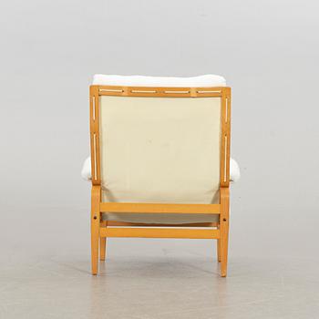 BRUNO MATHSSON, an "ingrid" armchair and stool for Dux. Late 20th century.