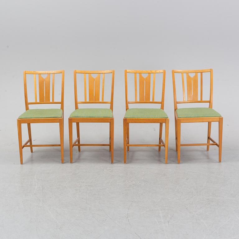 An oak dining table and four chairs by Carl Malmsten for Bodafors. Second half of the 20th Century.