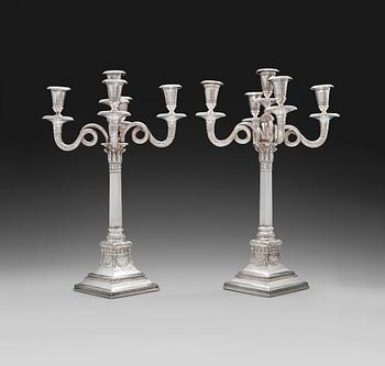 430. CHANDELAIRS, a pair. Silver. Germany, turn of century 18/1900. Height 47 cm. Total weight filling included 4085 g.